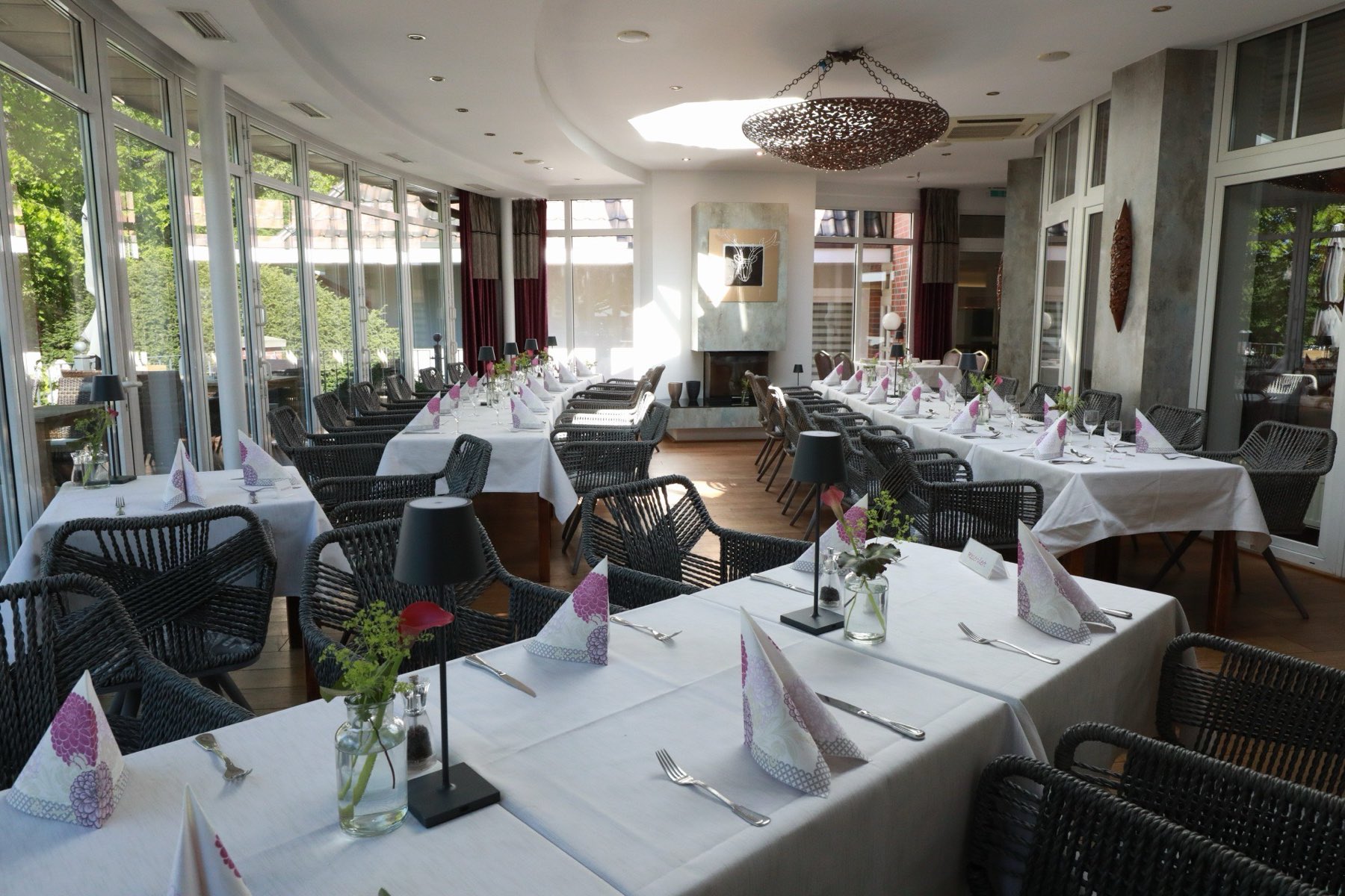 Tables laid in the conservatory of Hotel Robben